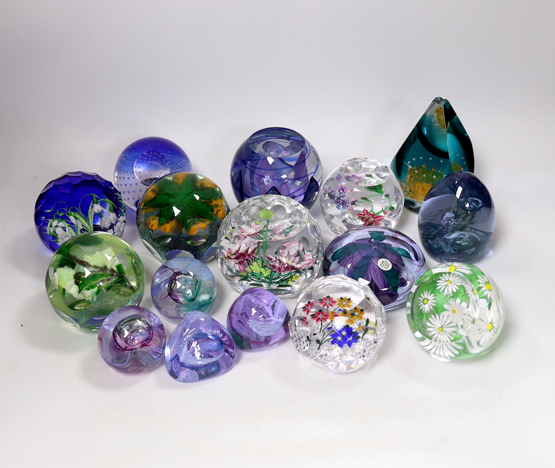 A collection of sixteen modern Caithness glass paperweights with boxes including some limited edition, largest 8cm high